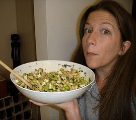 Cheri holding a bowl of homemade bean salad.