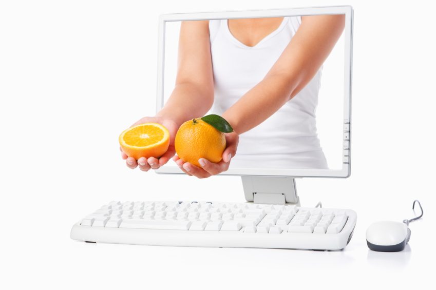 healthy-eating-hand-oranges-hands-computer